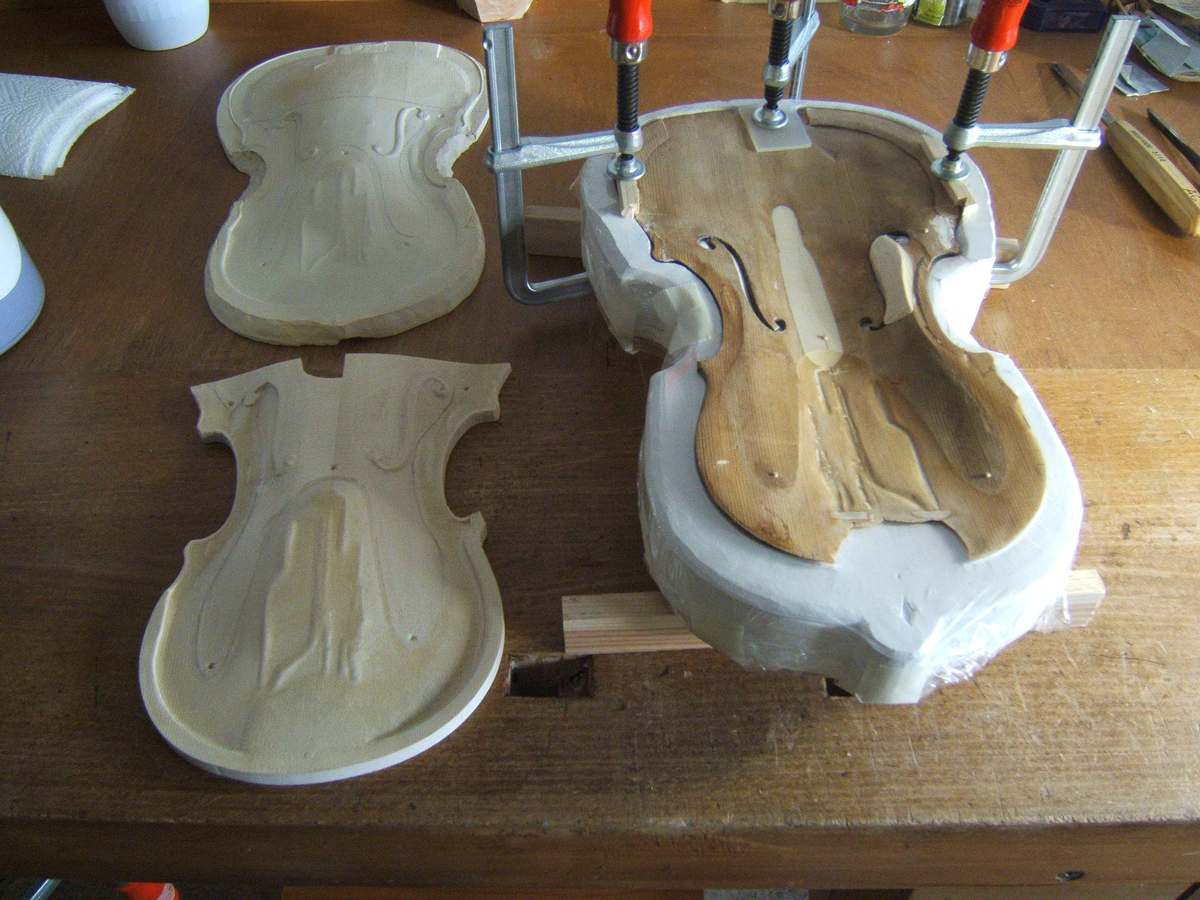 Plaster casts of the plates beside the instrument under repair